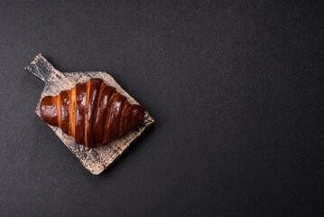Sweet fresh crispy croissant with chocolate filling