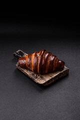 Sweet fresh crispy croissant with chocolate filling