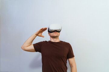 Man wearing virtual reality headset.A young guy in glasses and technology is a lifestyle future guy.