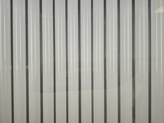 Obraz premium Vertical stripes create a contemporary aesthetic in a space with soft daytime lighting and sunbed lamps concept