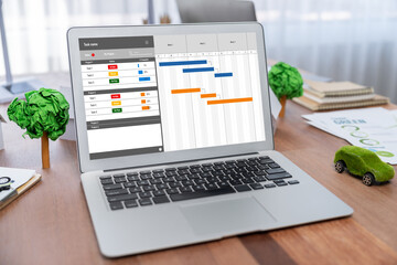 Project planning software for brisk business project management on the computer screen showing...