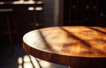 Obraz premium A beautiful, empty, round wooden tabletop counter in a clean and bright wine bar interior, with sunlight casting shadows