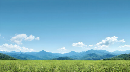 Fototapeta premium Panoramic View Of Lush Green Field With Distant Mountains And Bright Blue Sky