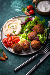 Salad with hummus, falafel and vegetables