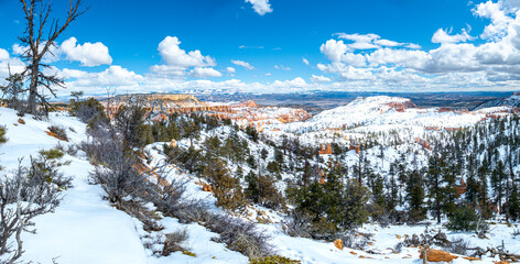 Panorama landscape of pinnacles of Bryce Canyon National Park covered in snow, Utah USA