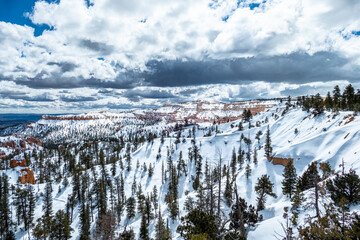 Landscape of pinnacles of Bryce Canyon National Park covered in snow, Utah USA