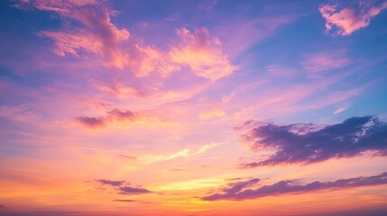 Fototapeta premium A Vibrant Sunset Sky Painted in Hues of Orange, Pink, and Purple