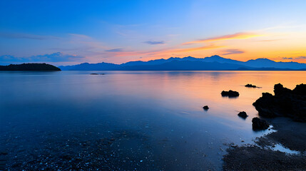 Sunset over Coastal Waters with Silhouetted Structures and Colorful Sky Reflection
