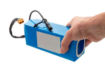 hand holding battery from electric bicycle. Lithium-ion industrial high current batteries, close-up, cut out.