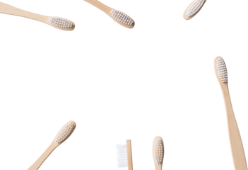 Set of ECO friendly wooden bamboo toothbrushes. Save the planet or NO plastic concept. Isolated on white background.