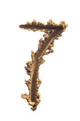 Naklejka premium Number seven written on a sandy beach. Handwritten characters collection.