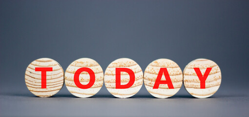 Fototapeta premium Today symbol. Concept word Today on beautiful wooden circles. Beautiful grey table grey background. Business lifestyle today concept. Copy space.