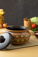 Brown ceramic baking dish with pattern on kitchen table