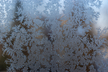Natural frost pattern on a window. Frost patterns. Icy window in the winter.