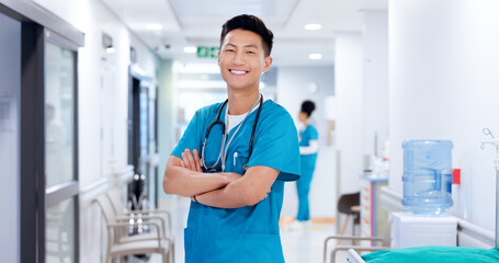 Crossed arms, man and portrait of nurse in hospital with confidence for healthcare career. Happy,...