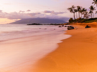 Sunset on The Golden Sand of Mokapu Beach With The Mountains of West Maui, Wailia, Maui, Hawaii, USA