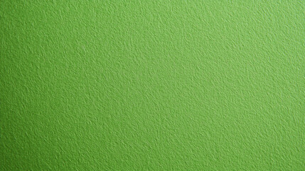 Obraz premium A close-up of a textured green surface, showcasing a smooth and vibrant appearance, ideal for backgrounds or design elements.