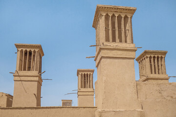 Panoramic view of traditional wind towers in Yazd, Iran. Such towers have been used in the East since ancient times to cool the air in the house. And for Yazd, it is a kind of symbol of the city