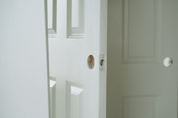 The holes in the door are designed for installing a handle and lock, which is an important stage of preparation.