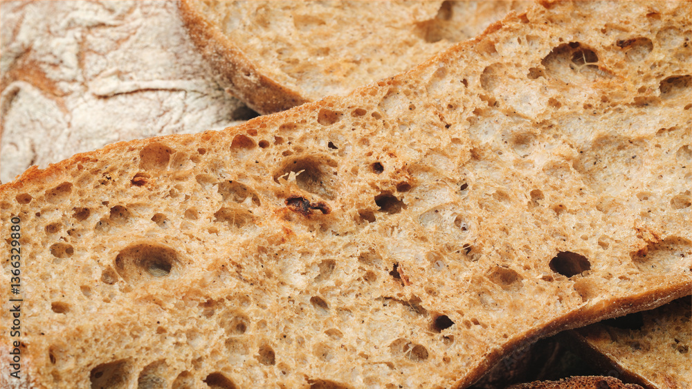 Aufkleber slice of bread with holes in it. the bread is brown and has a crust. the bread is cut in half and ha