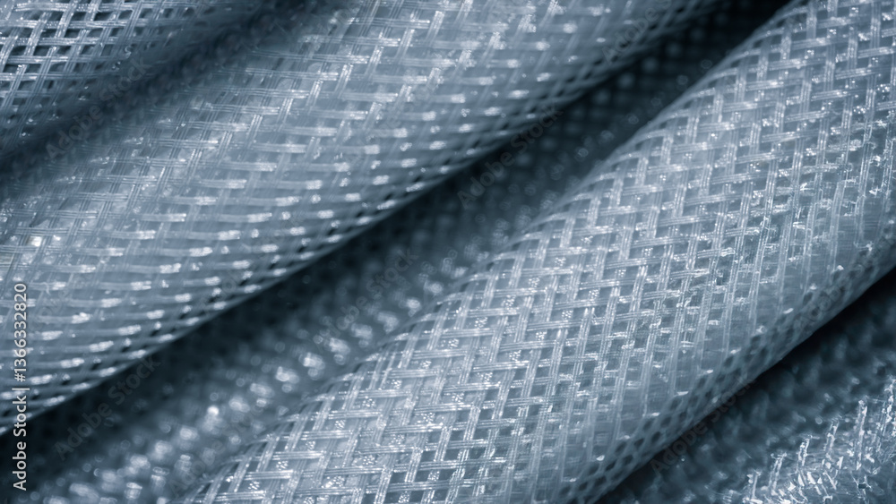 Poster A close up of a piece of plastic with a mesh pattern. Concept of texture and depth, with the plastic appearing to be layered and woven together. The mesh pattern adds a sense of movement