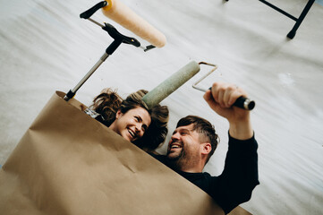 A couple jokes around while checking out how they look in rolls of wallpaper.