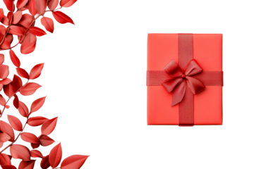 Red present and leaves on a black background, cut out transparent