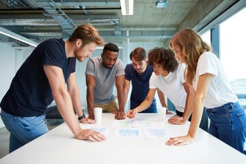 Young diverse team collaborating on project in modern office setting
