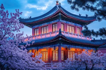 Wandcirkels  A traditional Chinese pavilion at twilight, framed by blossoming cherry blossoms.  Illuminated windows showcase the intricate architecture  © Dina