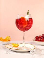 Royal lemonade cocktail with tequila, gin, rum, ice and grapes, bar and party concept, restaurant and cafe advertising card, elegant minimal background, selective focus.