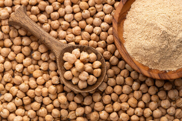 High quality raw chickpeas in the spoon and bowl - Cicer arietinum.
