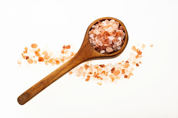 Fine salt and pink Himalayan crystals on the spoon