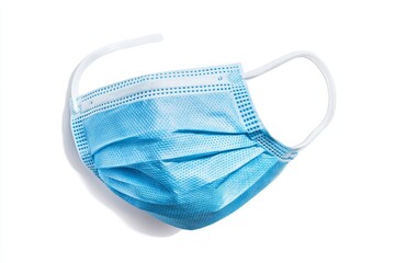 Light blue disposable face mask on white background