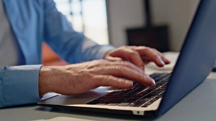 Man hands typing laptop in home office interior closeup. Guy texting keyboard