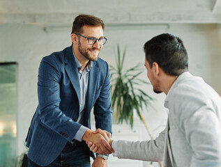 young business handshake hand shake shaking meeting agreement office teamwork partner businessman...