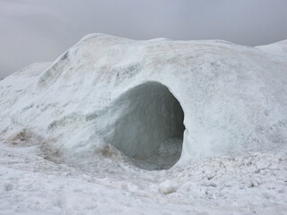 Entrance to the igloo. A hand-built snow shelter.
