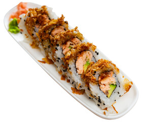 Appetizing set of rolls with rice, fish fillet, avocado and sesame seeds on a plate.. Isolated over white background
