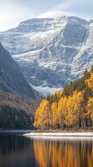 Obraz premium Autumnal lake reflecting snowy mountains