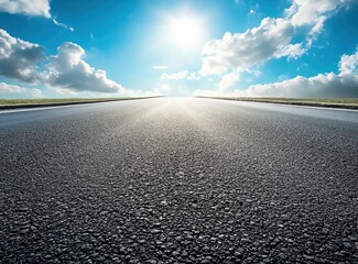 Driving on Asphalt Road Under Blue Sky with White Clouds and Sunlight