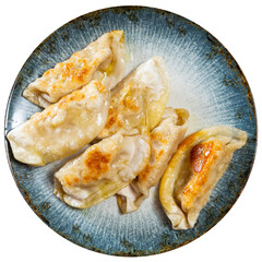 Delicious japanese gyoza dumplings stuffed with pork served on plate. Isolated over white background