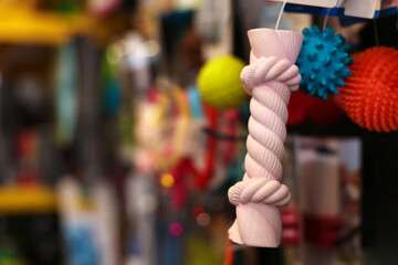 Toys on display in pet shop, closeup. Space for text