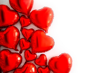 A set of red heart-shaped balloons on a white background.