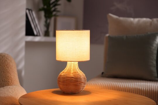 Stylish night lamp on wooden table indoors