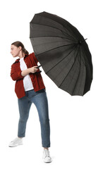 Young woman with black umbrella on white background