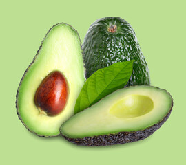 Whole and cut avocado fruits with fresh leaf on light green background