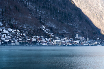 Bright sunny winter day, Alps, Hallstatt lake and village view.
