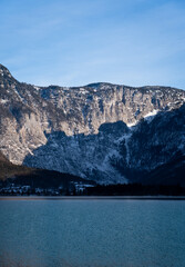 Bright sunny winter day, Alps, Hallstatt lake and village view.