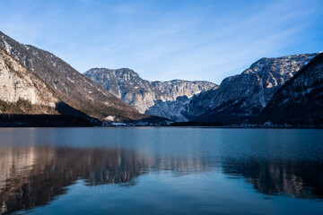 Bright sunny winter day, Alps, Hallstatt lake and village view.