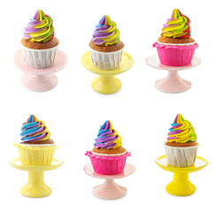 Yummy cupcakes with bright rainbow cream isolated on white, set