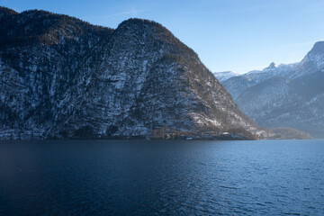 Bright sunny winter day, Alps, Hallstatt lake and village view.